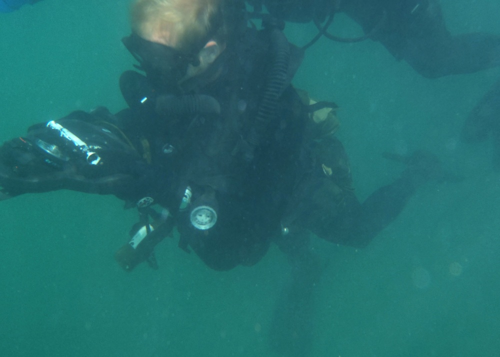 A U.S. Navy SEALs Practices Underwater Navigation During a Diving Exercise