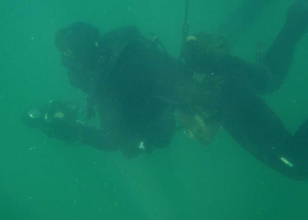 A U.S. Navy SEALs Practices Underwater Navigation During a Diving Exercise