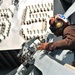 Sailor prepares helicopter for flight