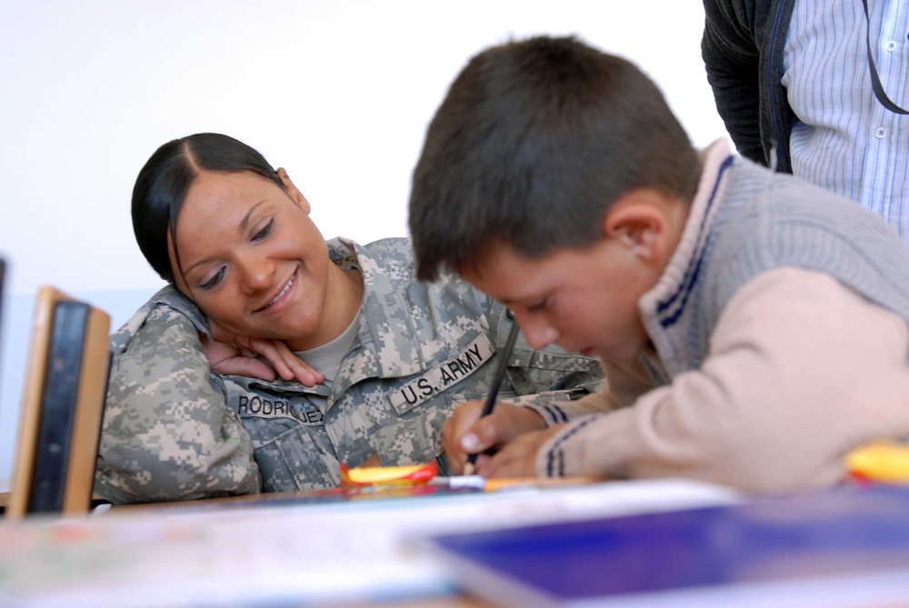 US Soldiers visit school children, donate school supplies