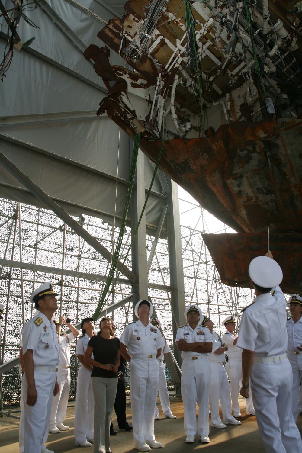 Sailors examine North Korean-attacked ship