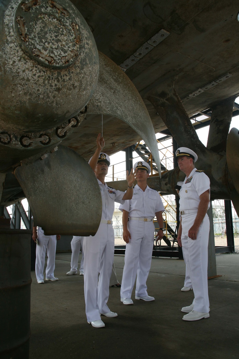 Sailors examine North Korean-attacked ship