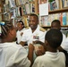 Sailor speaks with students