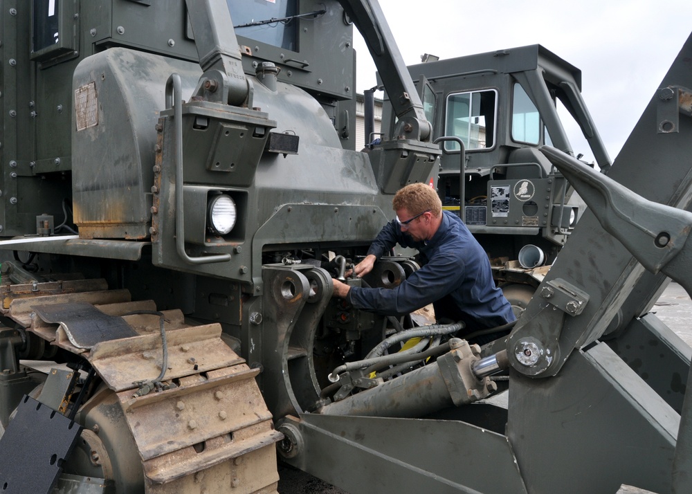 Mechanic finishes work on dozer