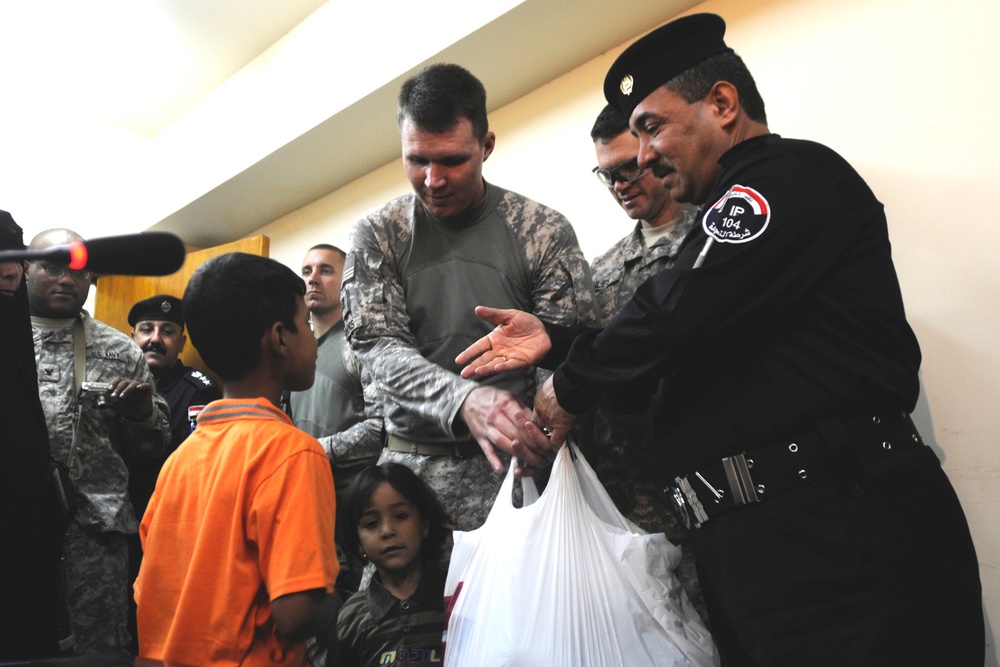 USD-C Soldiers coordinate aid for families of fallen Iraqi Policemen
