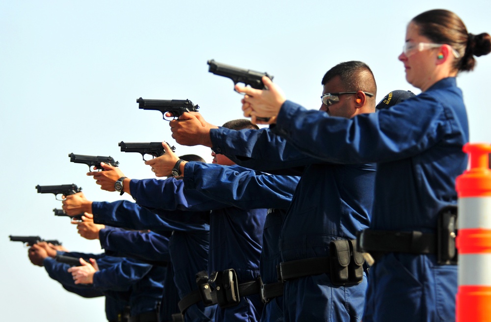 USS Pearl Harbor crew train with handguns