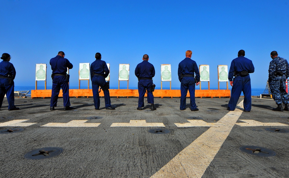 USS Pearl Harbor crew train with handguns