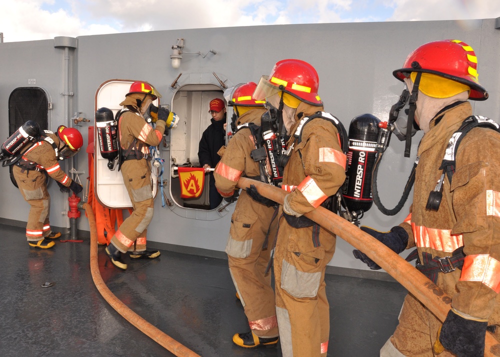 Navy firefighters train