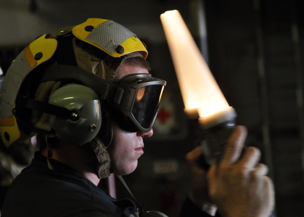 Sailor guides landing craft