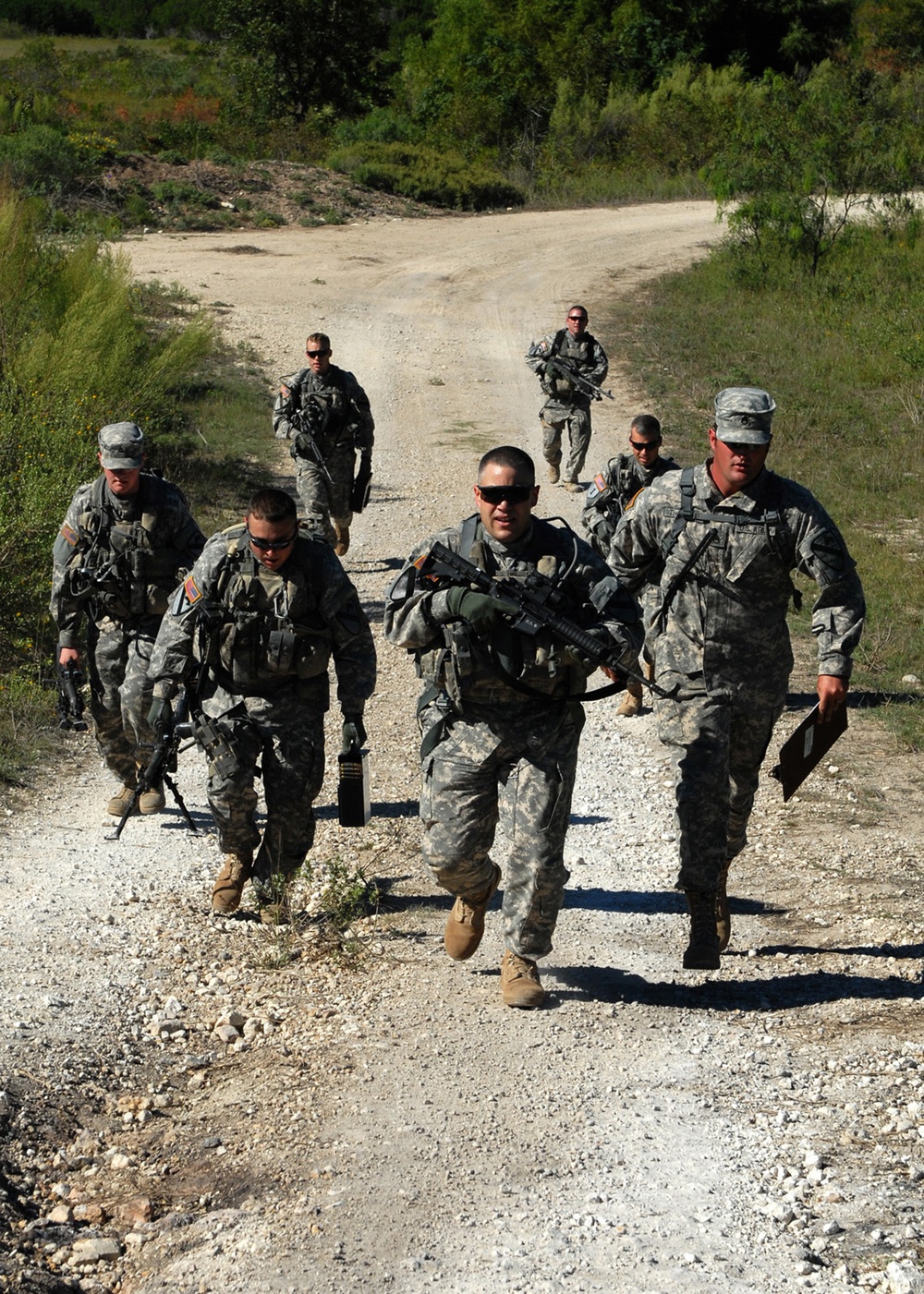 1st Air Cav soldiers run and gun