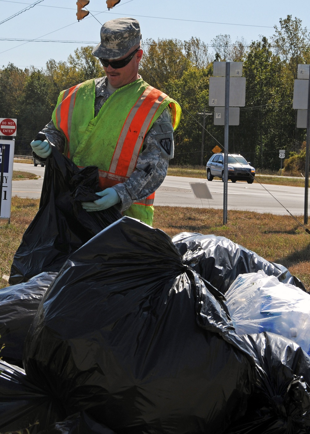 Soldiers pick up litter