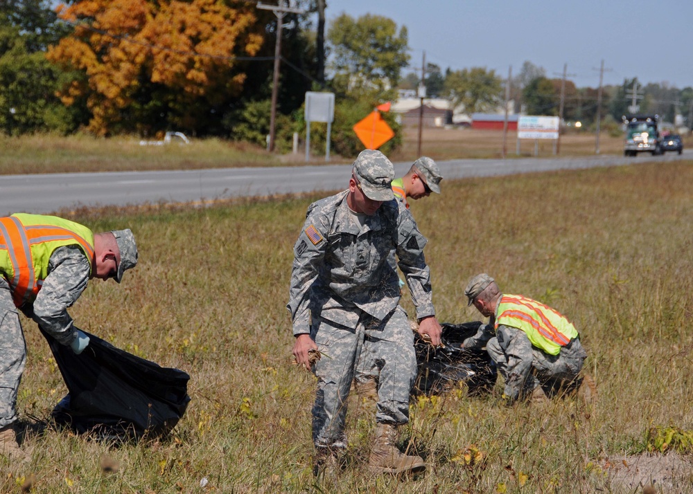 Soldiers pick up litter