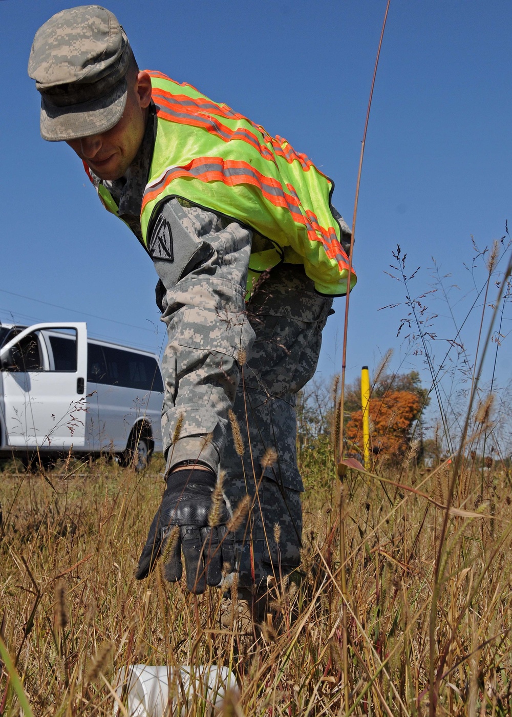 Soldiers pick up litter