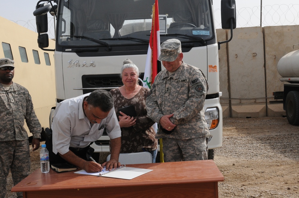 USF-I transfers vehicles to ministry of justice