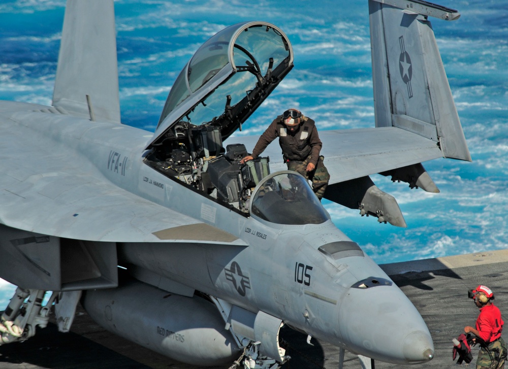 Sailor Enters Super Hornet on USS Enterprise