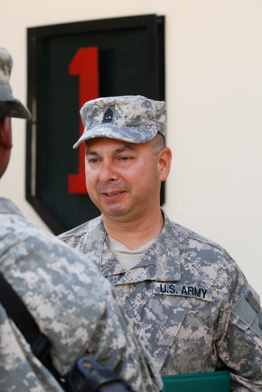 Army first sergeant re-enlists