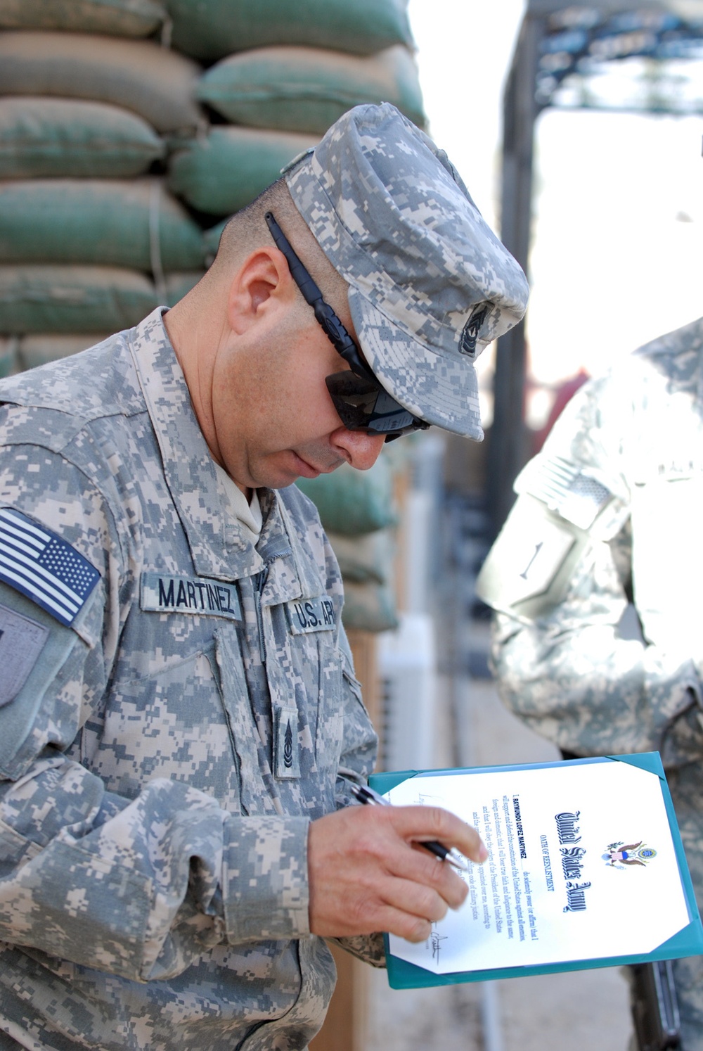 Army first sergeant re-enlists