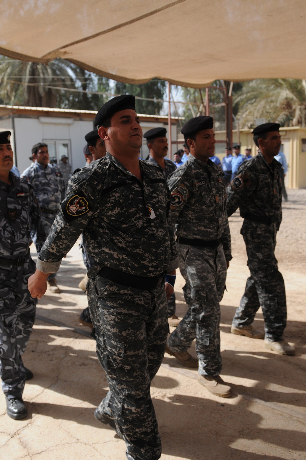 Iraqi police complete mid-course curriculum with aid of USD-C MPs