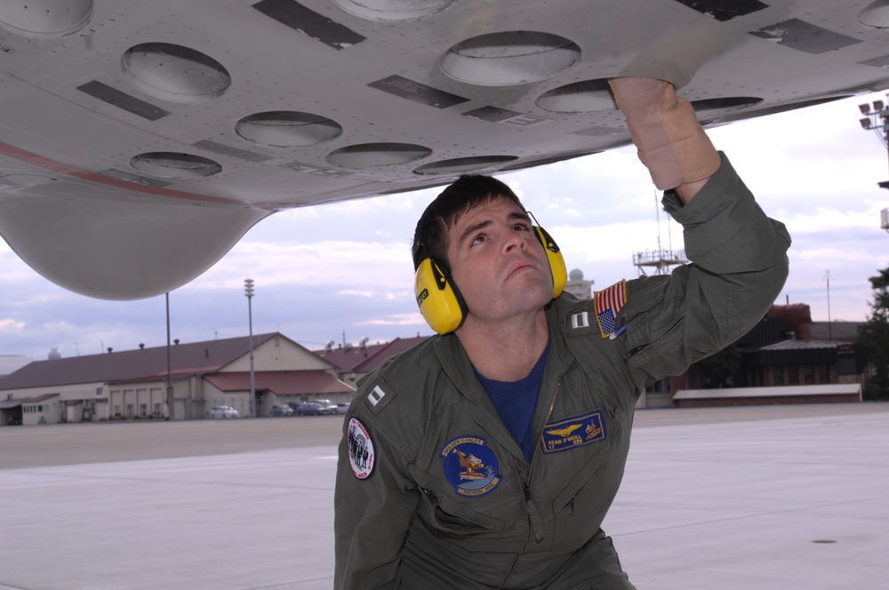 VP-9 Crew Members Conduct Preflight Checks on P-3 Aircraft
