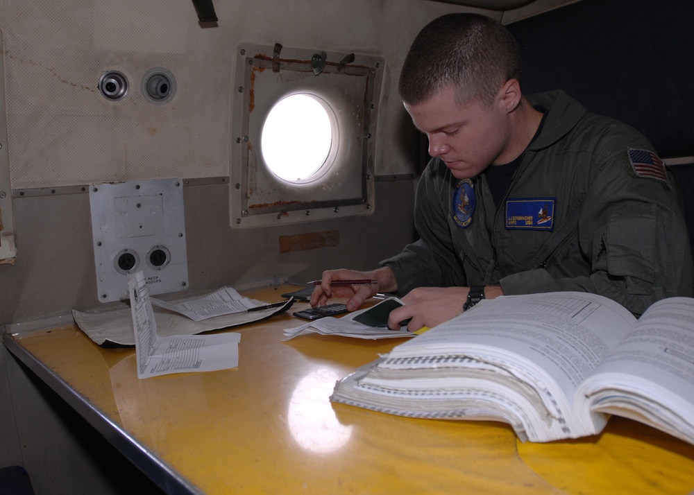 VP-9 Crew Members Conduct Preflight Checks on P-3 Aircraft
