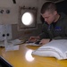 VP-9 Crew Members Conduct Preflight Checks on P-3 Aircraft