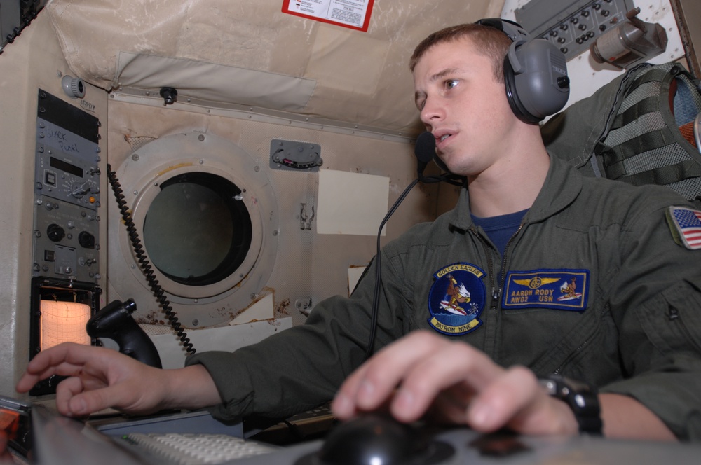 VP-9 Crew Members Conduct Preflight Checks on P-3 Aircraft