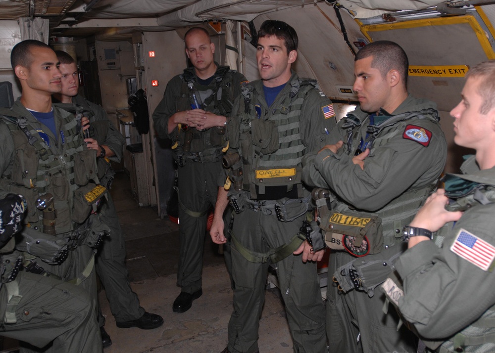 VP-9 Crew Members Conduct Preflight Checks on P-3 Aircraft