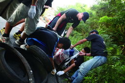 Service members clean community