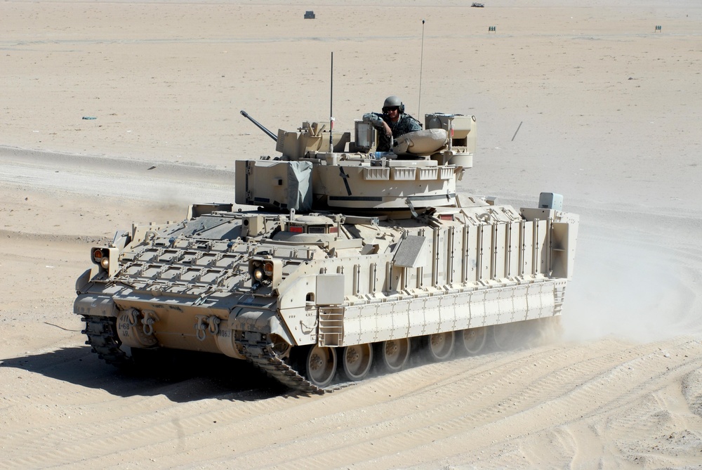 Deployed Advise and Assist Brigade trains on their big guns with gunnery in Kuwait