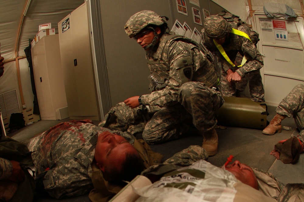 A 1st Sustainment Brigade Soldier provides medical aid during the Combat Lifesavers Course