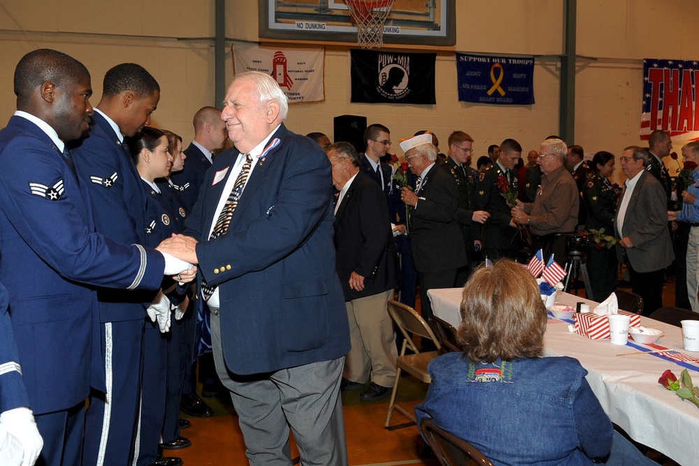 Retired veterans honor active duty military during the Veterans Day ceremony Nov. 4. The Niners Citizen's Club hosted the event at the South Norfolk Community Recreation Center to honor all active duty and retired military.