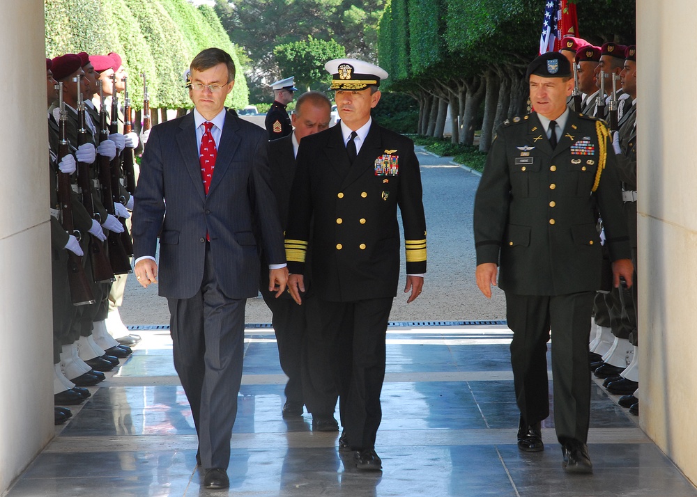 U.S. Ambassador to Tunisia Gordon Gray, Vice Adm. Harry B. Harris Jr., commander of the U.S. 6th Fleet, and Col. John E. Chere Jr., Defense Attaché, arrive at the North Africa American Cemetery for the Veterans Day wreath-laying ceremony honoring American