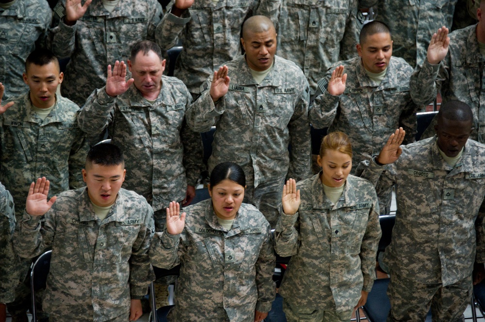 Soldiers take the Oath of Allegiance during a Veterans Day Naturalization Ceremony at Al Faw Palace at Camp Victory, Iraq. During the ceremony, sponsored by United States Forces-Iraq, 50 service members became U.S. citizens.