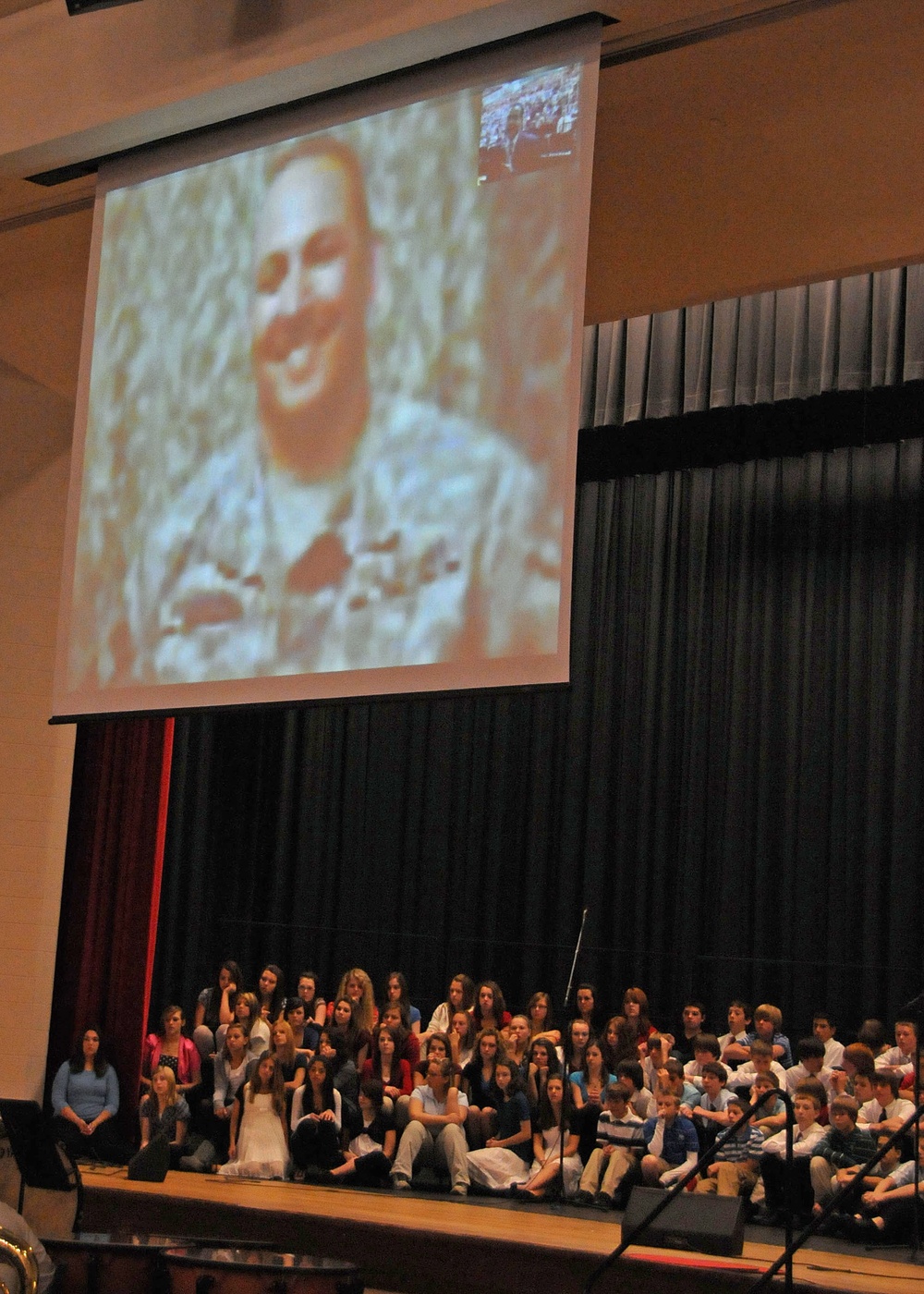 Soldier in a Combat Zone Talks with Students