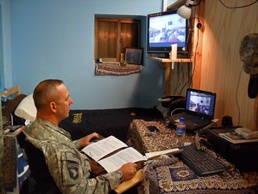 Soldier in a Combat Zone Talks with Students