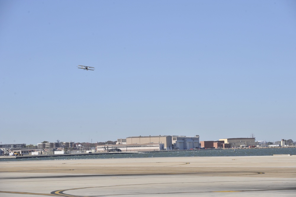 Replica Curtis bi-plane conducts a flyover celebrating 100 years of Naval Aviation