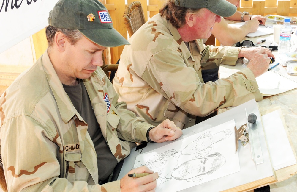 Cartoonists visit, draw for Coalition troops