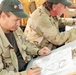 Cartoonists visit, draw for Coalition troops
