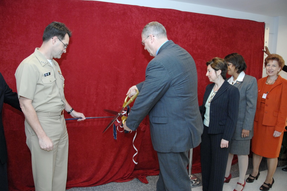 Under Secretary of the Navy Robert O. Work cut the ceremonial ribbon and unveiled a permanent wall display inside the Pentagon for CFC