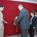 Under Secretary of the Navy Robert O. Work cut the ceremonial ribbon and unveiled a permanent wall display inside the Pentagon for CFC