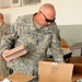 National Guardsmen distribute school supplies