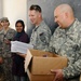 National Guardsmen distribute school supplies