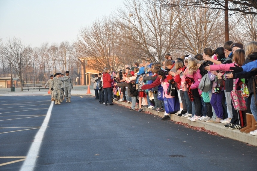 Tots share treats with troops, Afghan kids