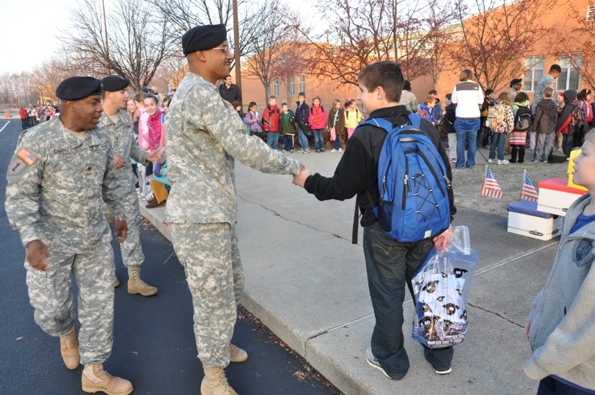 Tots share treats with troops, Afghan kids