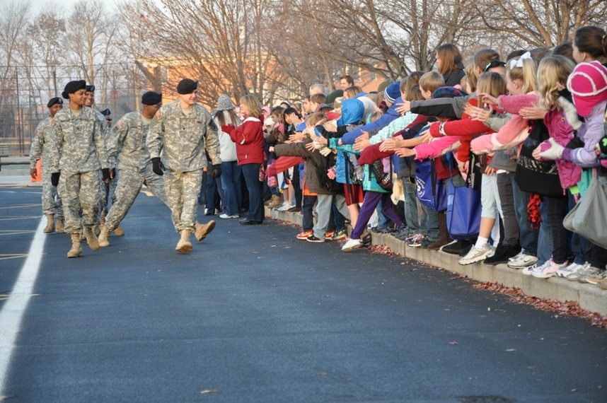 Tots share treats with troops, Afghan kids