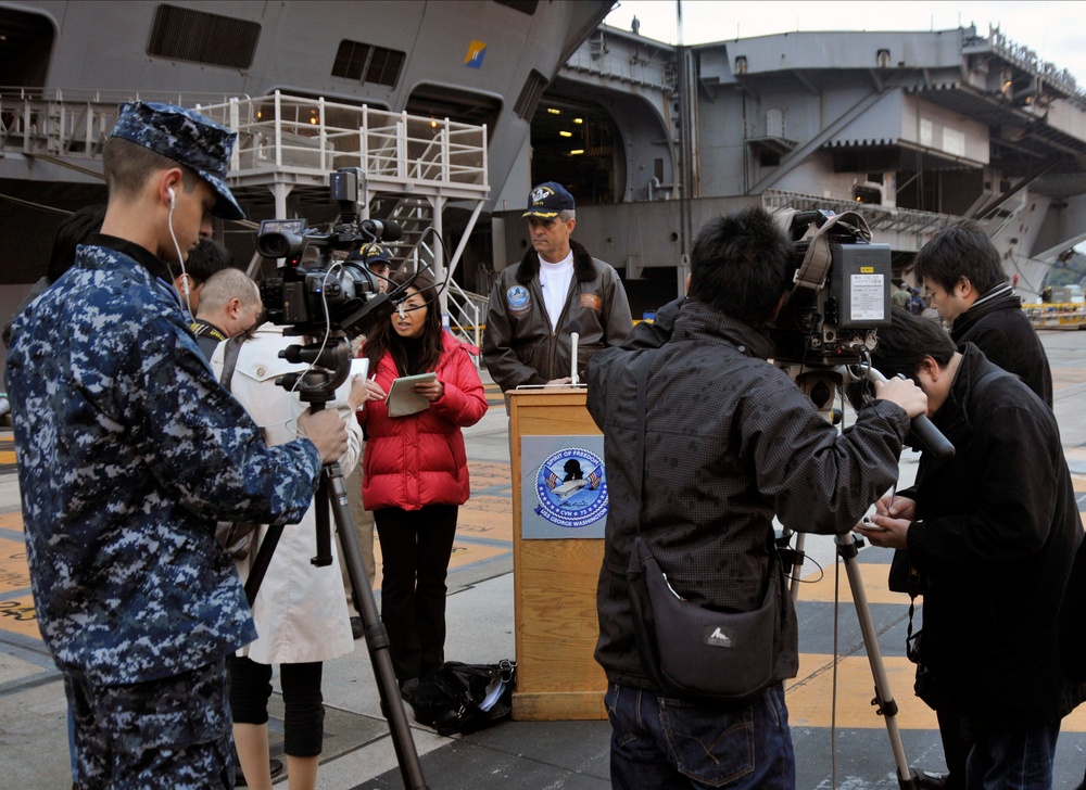 Sailors speak with Japanese media