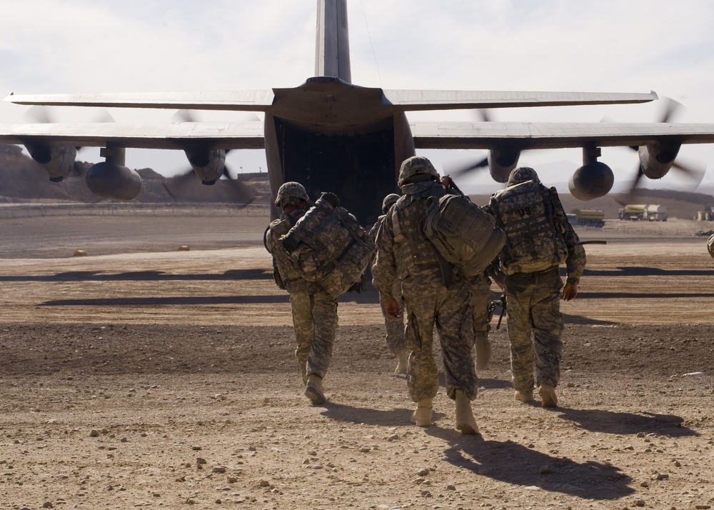 Soldiers Prepare To Embark C-130