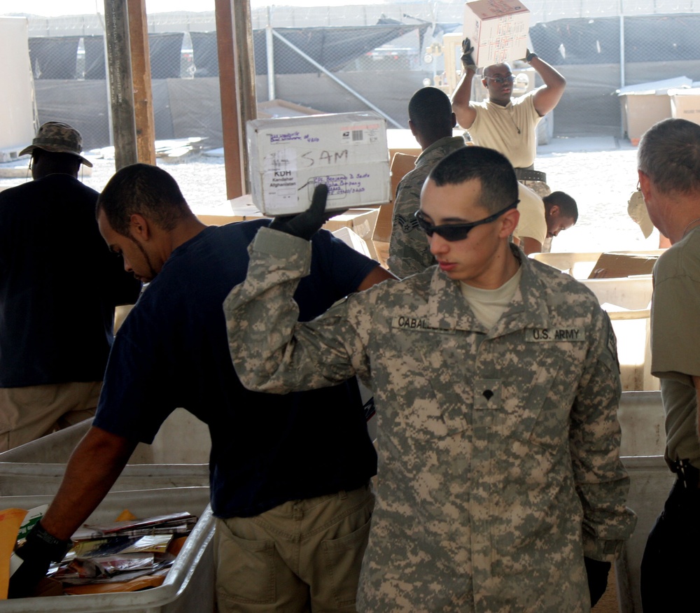 Sustainment soldiers in southern Afghanistan unite, work around the clock to tackle holiday mail surge