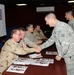 Soldier meets favorite author: Action thriller authors visit service members in Basra