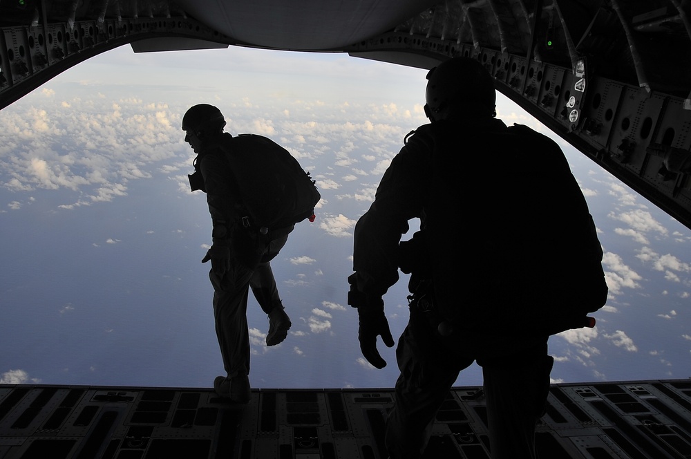 Soldiers and Marines Leap from C-17
